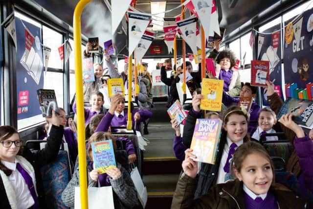 The launch of Get Hastings Reading. Children from The Baird Primary Academy are excited to receive a free book each to take home. Photo by Caitlin Lock. SUS-190130-141842001