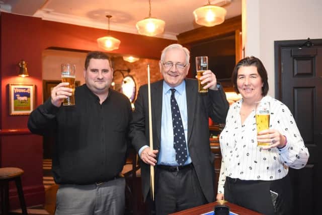 Sir Peter Bottomley MP for Worthing West constituency (centre) with Steve Pease (licensee) and Sarah Bramley (Star Pubs & Bars area manager) at the Park View pub in Durrington after its refurbishment  Photograph taken by Simon Dack