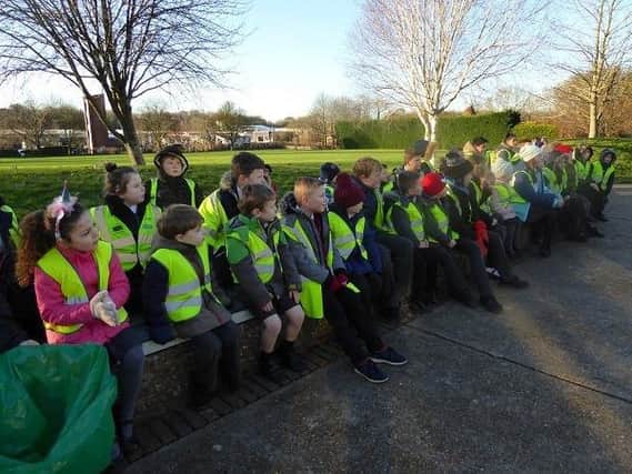 Pupils from Holy Cross CEP School and volunteers from Brighter Uckfield tackle the town's litter