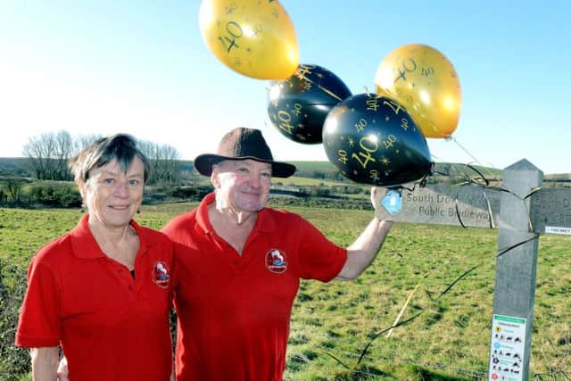 Keith McKenna and Sally Dench celebrating the 40th anniversary of the South Downs Way Annual Walk. Picture: Kate Shemilt ks190040-1