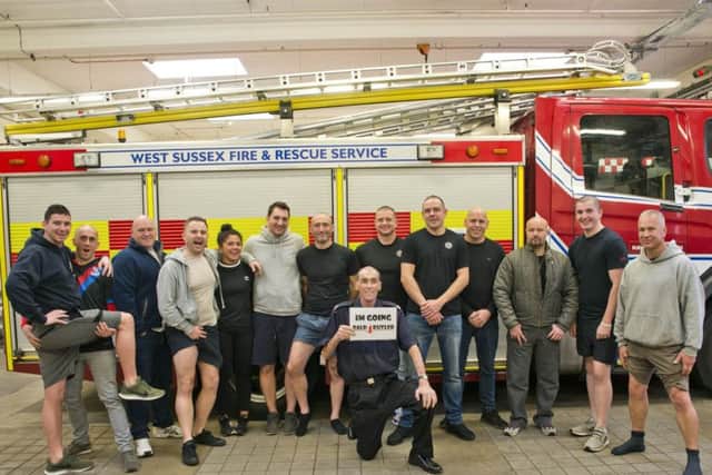 Mark Butler (middle) and his colleagues at Haywards Heath Fire Station. Photo by Eddie Howland