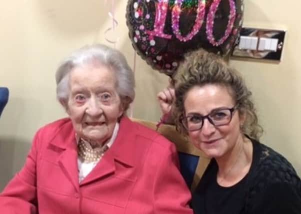Olivia Jordan from Cranleigh at her 100th birthday party, pictured with Jo Burgess who helped with the celebrations SUS-190502-102000001