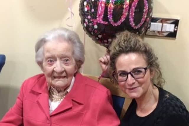 Olivia Jordan from Cranleigh at her 100th birthday party, pictured with Jo Burgess who helped with the celebrations SUS-190502-102000001