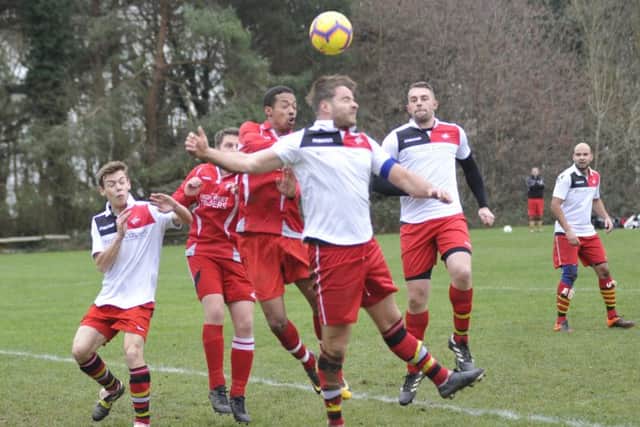 The heads go up at a corner in the match between Rock-a-Nore and Peche Hill Select