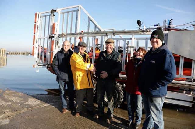 Tony Edwards LOM at Rye Harbour receiving a donation from Ron Baker. Photo by Kt Bruce