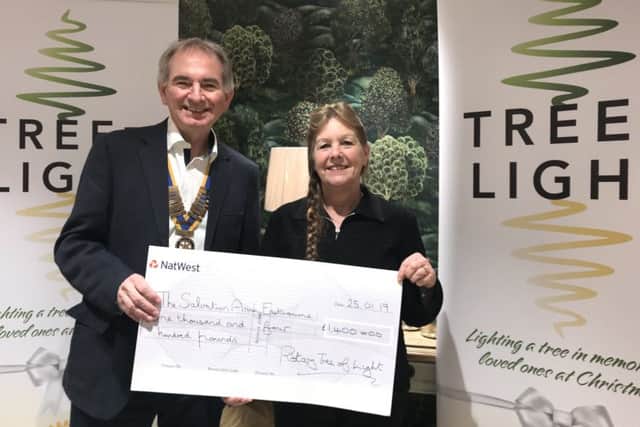 Rotary Tree of Light cheque presentation in Eastbourne.The Salvation Army's Rebourne Corner Day Centre representatives receive a cheque. SUS-190131-140634001
