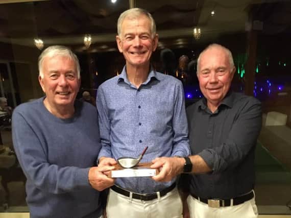 Hunston Trophy winner Jim Robertson, centre, with his closest rivals for the trophy