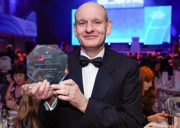 Michael Gevaux clutches his prize at the British Gymnastics Awards. Picture courtesy Alan Edwards / British Gymnastics