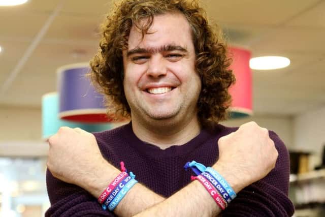 Daniel Wakeford wearing World Cancer Day unity bands