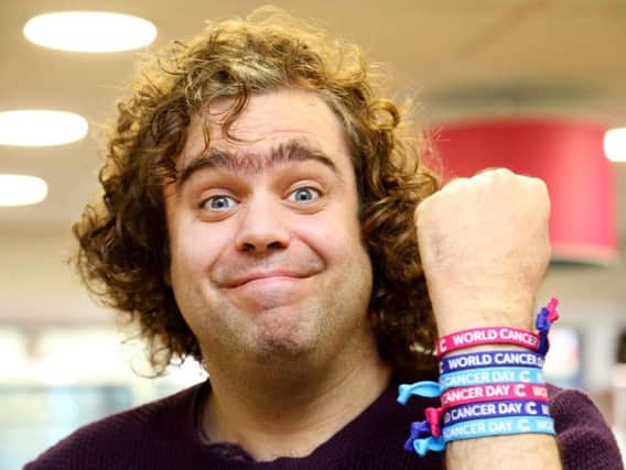 Daniel Wakeford wearing World Cancer Day unity bands