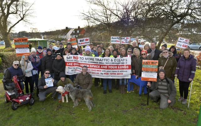 Residents before their march to demonstrate against the proposed developement of 700 homes at Morning Mills Farm in Willingdon (Photo by Jon Rigby)
