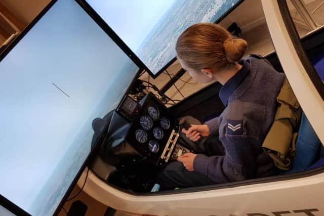 Corporal Rosie Dyett at the contols of the simulator