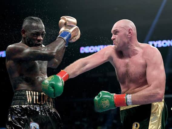 Tyson Fury lands a blow on Deontay Wilder. Picture: Getty Images