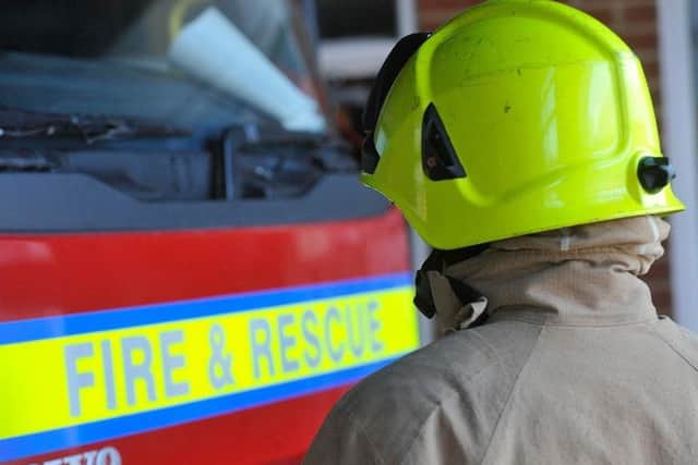 A man has been rescued from a fire in a high-rise block of flats in Sussex.