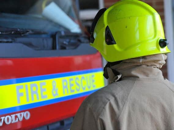 A man has been rescued from a fire in a high-rise block of flats in Sussex.