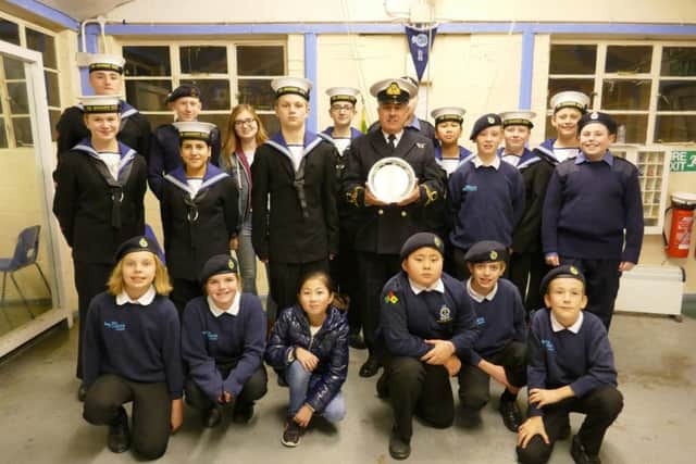 Commanding officer Lt (SCC) Brian Osborne presents Littlehampton Sea Cadets with the new District Endeavour Trophy
