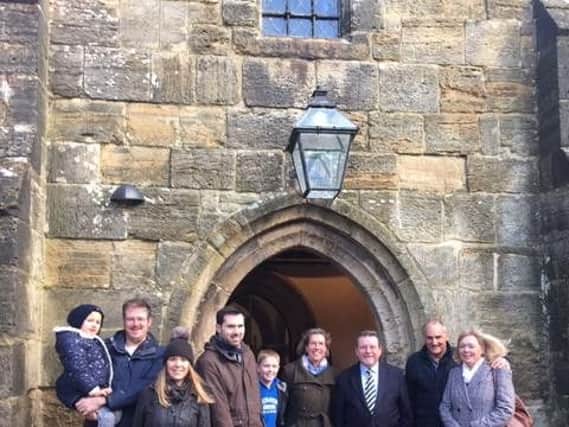 Vicar James Clarke with members of the congregation returning to All
Saints Church on Sunday