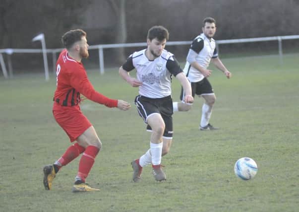 Connor Robertson on the ball during Bexhill United's 4-0 win at home to Worthing United. Picture by Simon Newstead