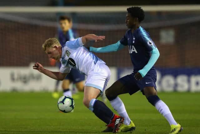 Willem Tomlinson playing for Blackburn Rovers holds off a challenge from Paris Maghoma of Tottenham Hotspur during the Premier League 2 match between in September (Photo by Alex Livesey/Getty Images)