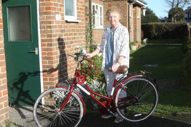 Rua O'Neill with her bike, which she was riding before she collapsed on the riverbank