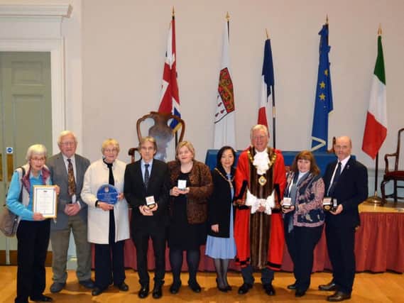 Recipients of this year's awards with the mayor and mayoress