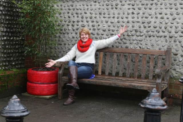 Councillor Catherine Arnold by the bench and new plant in Brunswick Road