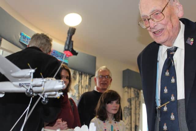 John Oliver 'Jo' Lancaster admires his Lancaster bomber cake