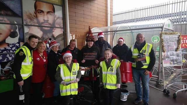 Surviving the Streets UK collecting donations before Christmas with James Robinson on the left SUS-171227-124337001