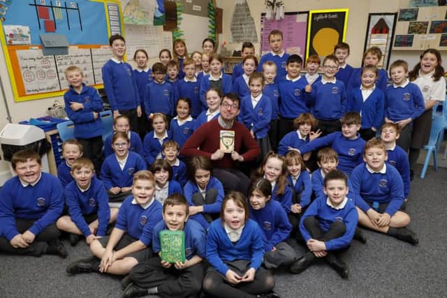 Professional storyteller Ross James Montgomery visiting pupils at Thakeham Primary School during National Storytelling Week SUS-190602-115607001