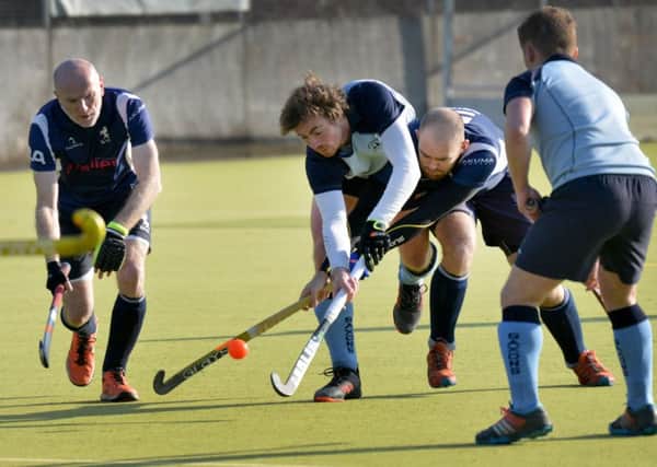 Nick Taylor in the thick of the action during South Saxons' 4-1 win at home to BBHC. Picture by Justin Lycett