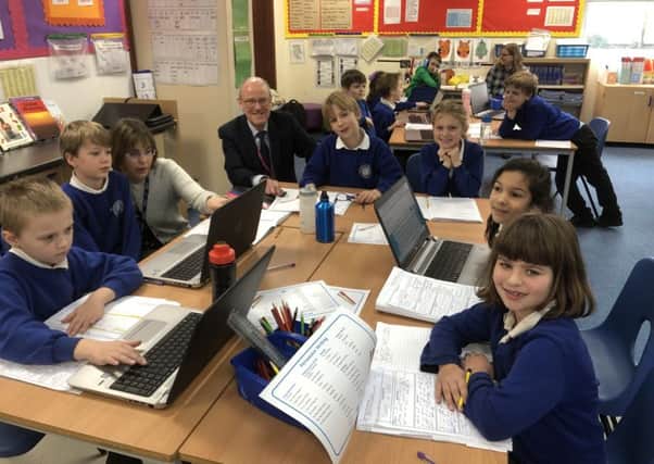 Nick Gibb pictured with Headteacher Mrs Sarah Titley and pupils taking part in the Prince William Award Scheme
