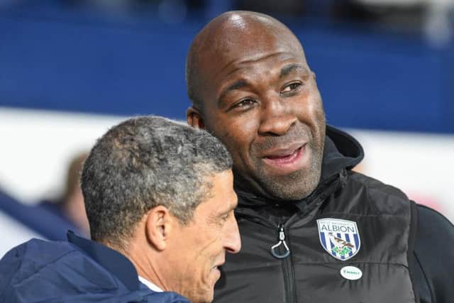 West Brom manager Darren Moore (centre) and Brighton boss Chris Hughton