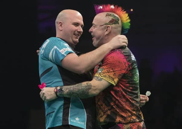 Rob Cross (left) and Peter Wright are all smiles after their 6-6 draw in Newcastle. Picture courtesy Lawrence Lustig/PDC