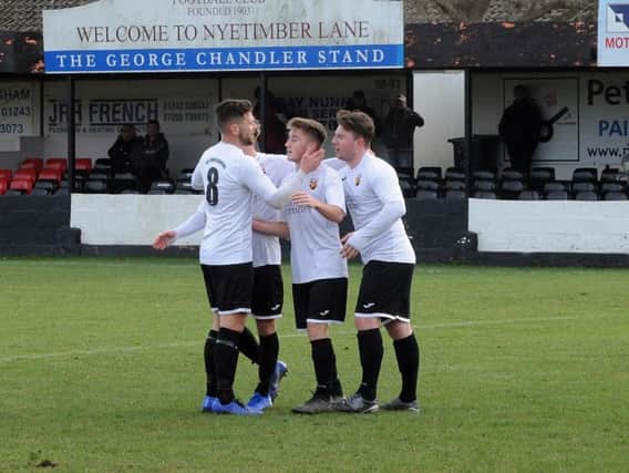 Pagham celebrate Harry Prisk's goal / Picture by Kate Shemilt