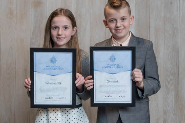 Oliver and Francesca Hook, aged 11 and nine, confronted a person who had stolen a plastic shark head from the the play area at Hove Lagoon