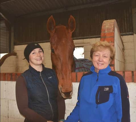 Mary and head girl Leanne Bird with Detour Ahead, a chestnut mare currently being retrained at Moorcroft