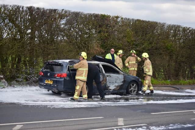 Firefighters on scene at the car fire on the A22 in Lower Dicker, photo by Dan Jessup