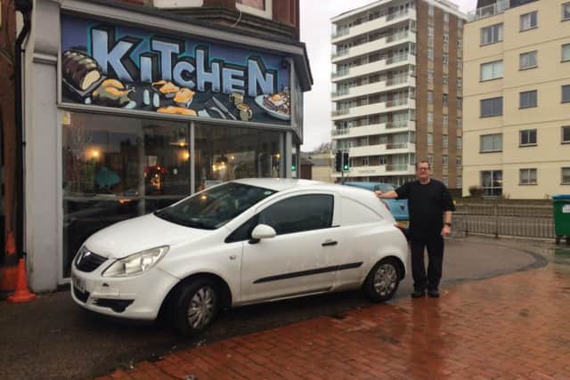 Jason Earl with his car parked on the land outside his restaurant in Brighton Road, Worthing