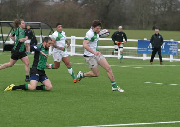 Joe Wilde on the way to touching down one of his five tries against Heathfield & Waldron. Picture by Clive Turner