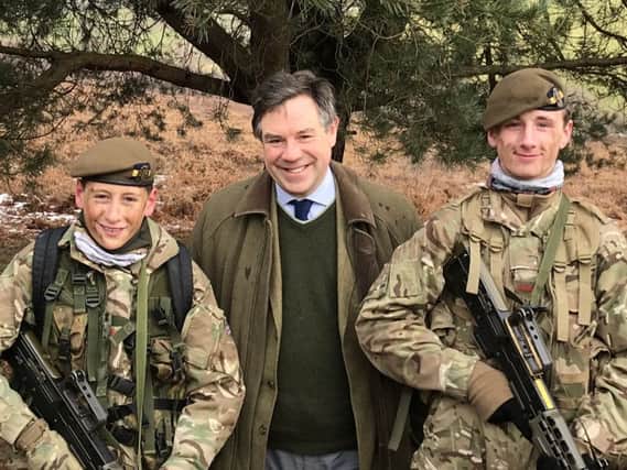 Jeremy Quin with members of the Horsham Army Cadet Force at Crowborough Camp