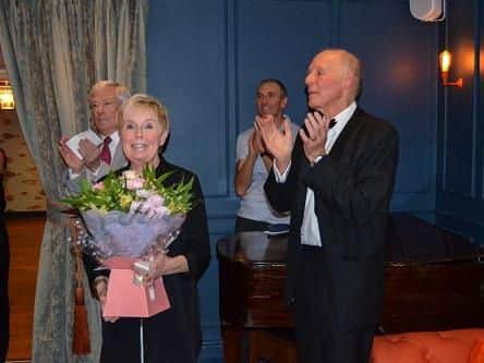 Sandra Clubb receives a bouquet of flowers from Lancing Eagles in recognition of her support for husband David during his time as chairman