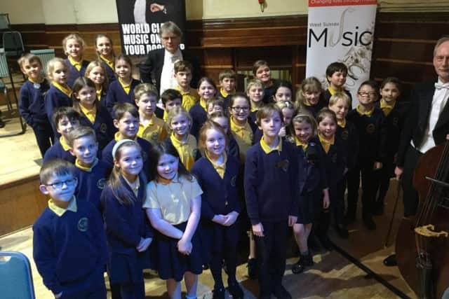 Upper Beeding pupils with conductor John Gibbons