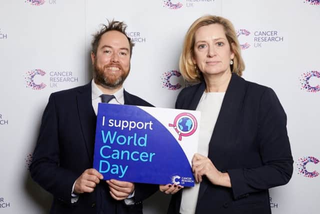 Amber Rudd, MP with Shaun Walsh supporting World Cancer Day SUS-190214-115109001
