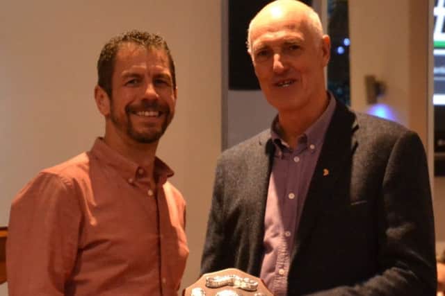 Graeme Grass receives one of his five prizes