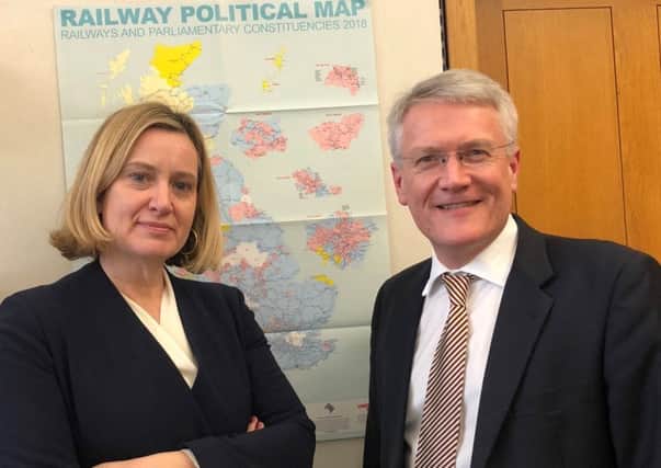 Amber is pictured with Andrew Jones, the Minister responsible for rail SUS-190225-114422001