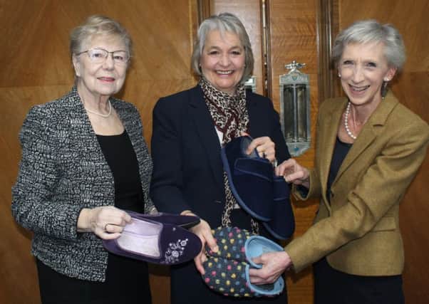 Slipper swap, county councillor Anne Jones, cabinet member Amanda Jupp and county council leader Louise Goldsmith