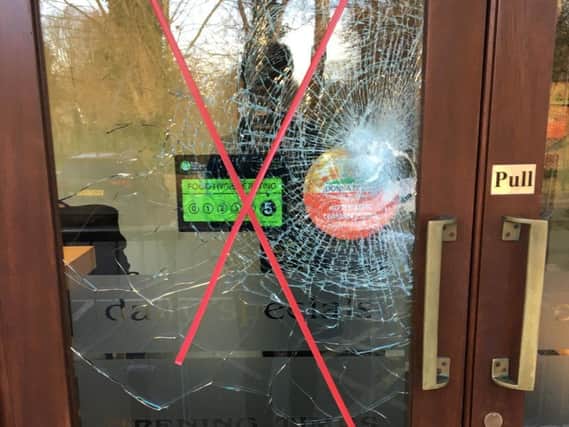 Damage to the front door of Snack Shack