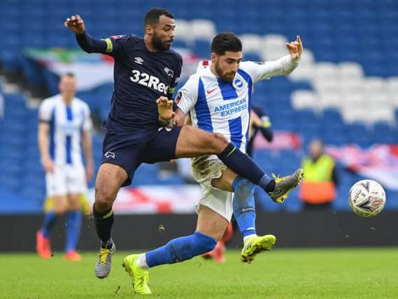Brighton winger Alireza Jahanbakhsh battles for possession with Derby defender Ashley Cole in Saturday's FA Cup fifth round tie. Picture by PW Sporting Photography