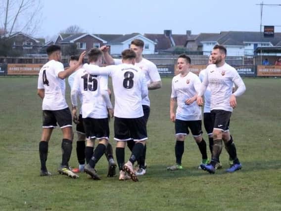 Pagham celebrate a recent goal against Loxwood - but they couldn't find the net at Gorings Mead / Picture by Roger Smith