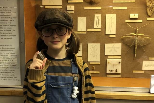 Billie Wildmay, 9 with her phial of banana DNA at the Booth Museum